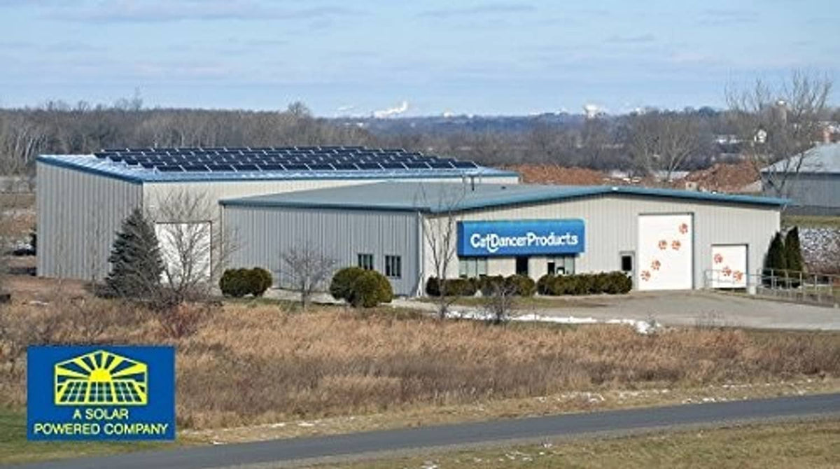 Solar-powered CatDancerProducts factory building with solar panels outside