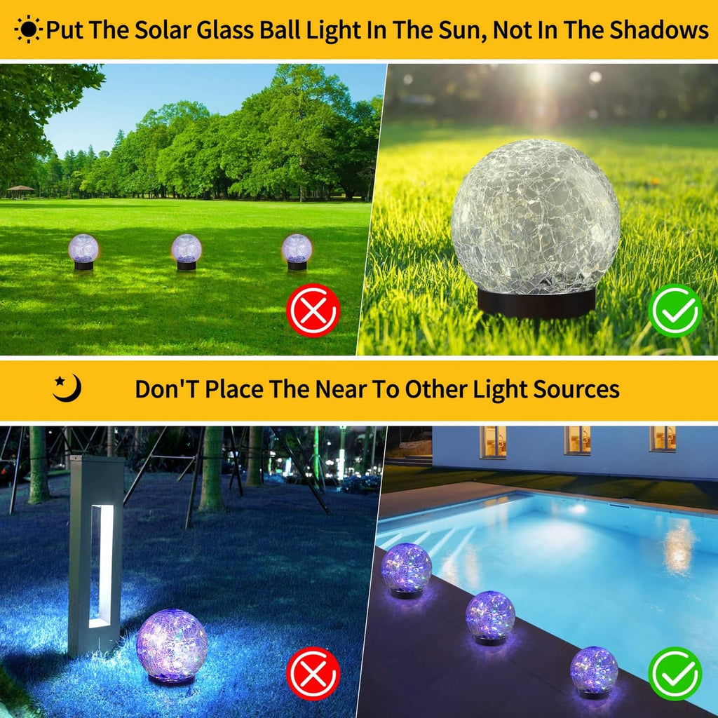Solar glass globe light with bright purple multicolor glow on a ground base
