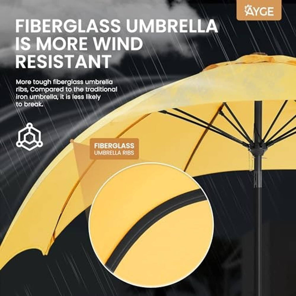Yellow patio umbrella canopy with rib detail and sturdy pole connection