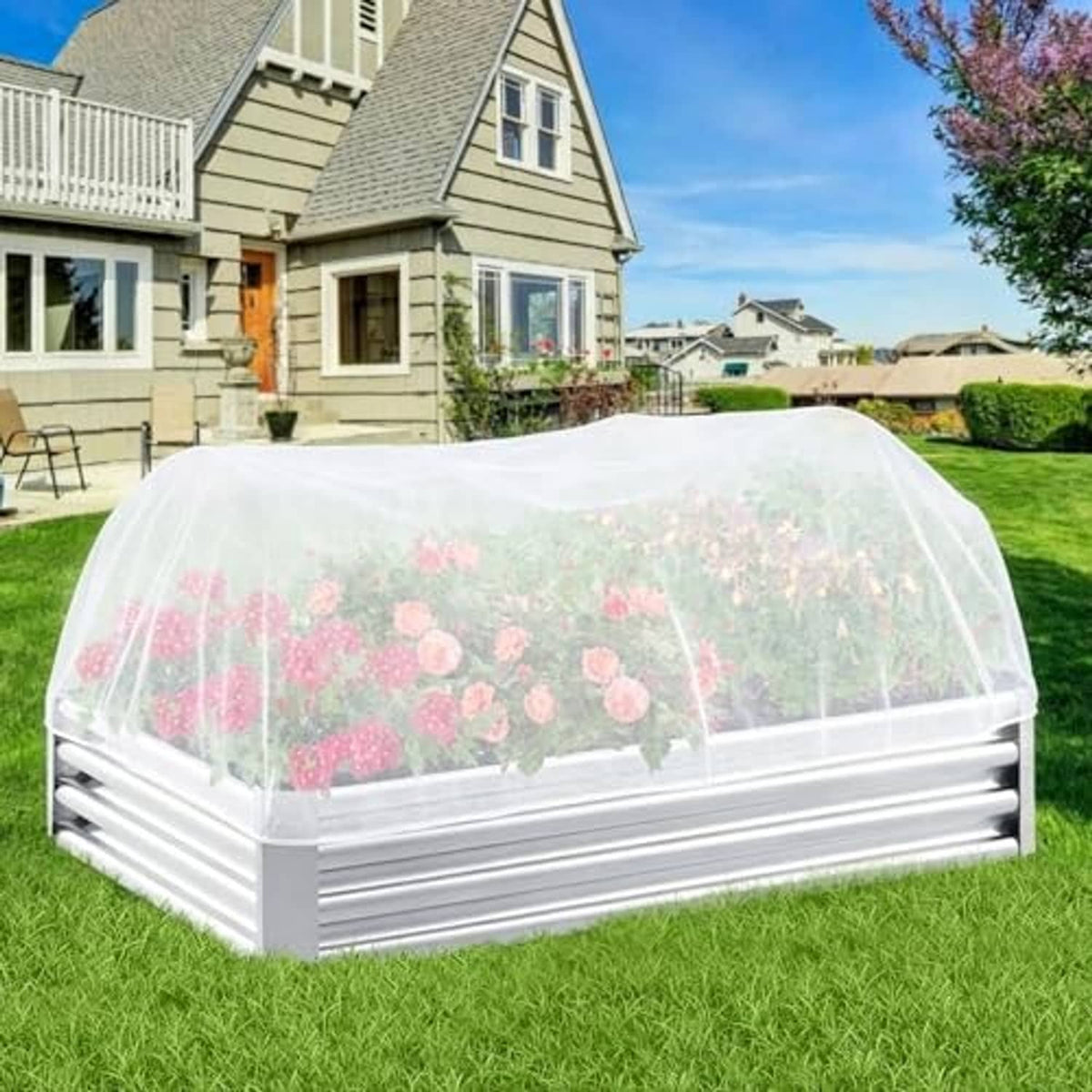 White garden shade net cover draped over raised bed frame with translucent top.