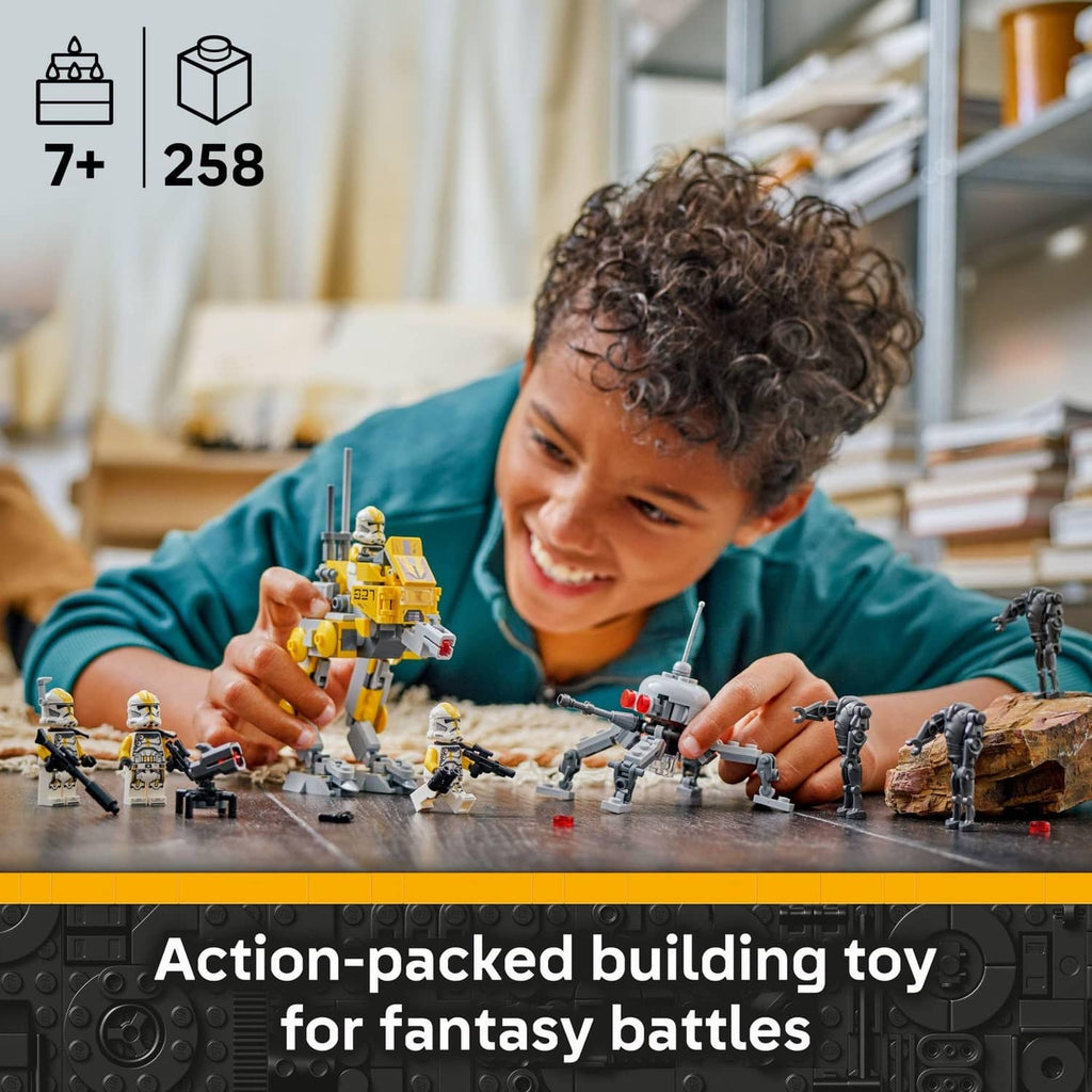 Yellow clone trooper action set pieces arranged on a tabletop for play