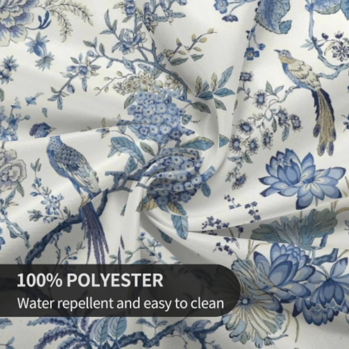 Blue-and-white chinoiserie tablecloth fabric close-up with flowers and birds