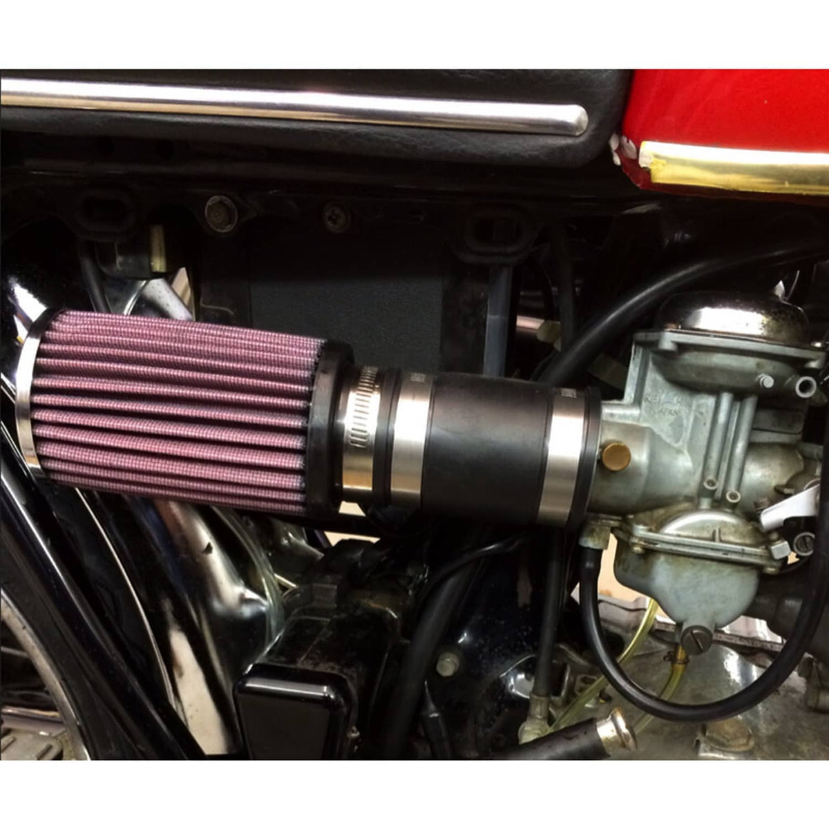 Air pod filter installed on engine intake, showing red pleated element