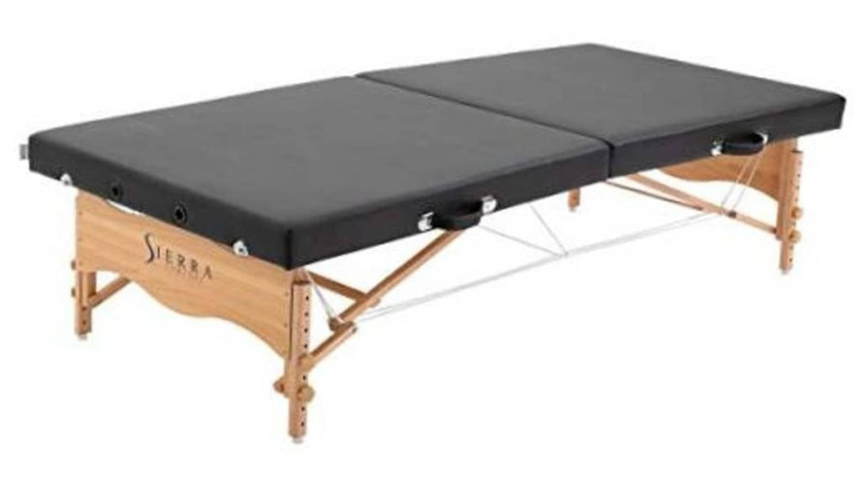 Black padded portable massage table with wooden legs and split backrest sections