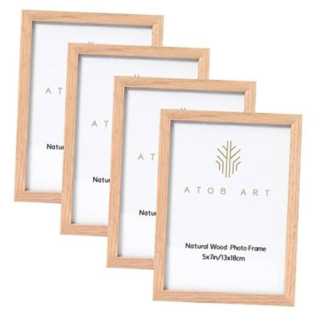 Set of four natural oak 5x7 photo frames, shown front with white inserts