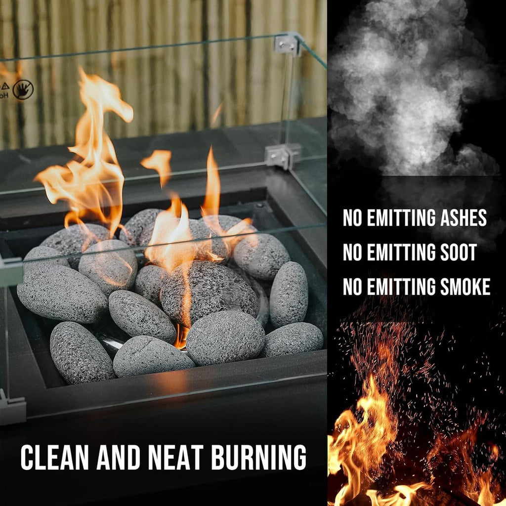 Black lava rocks burning in a fire pit with flames and smoke
