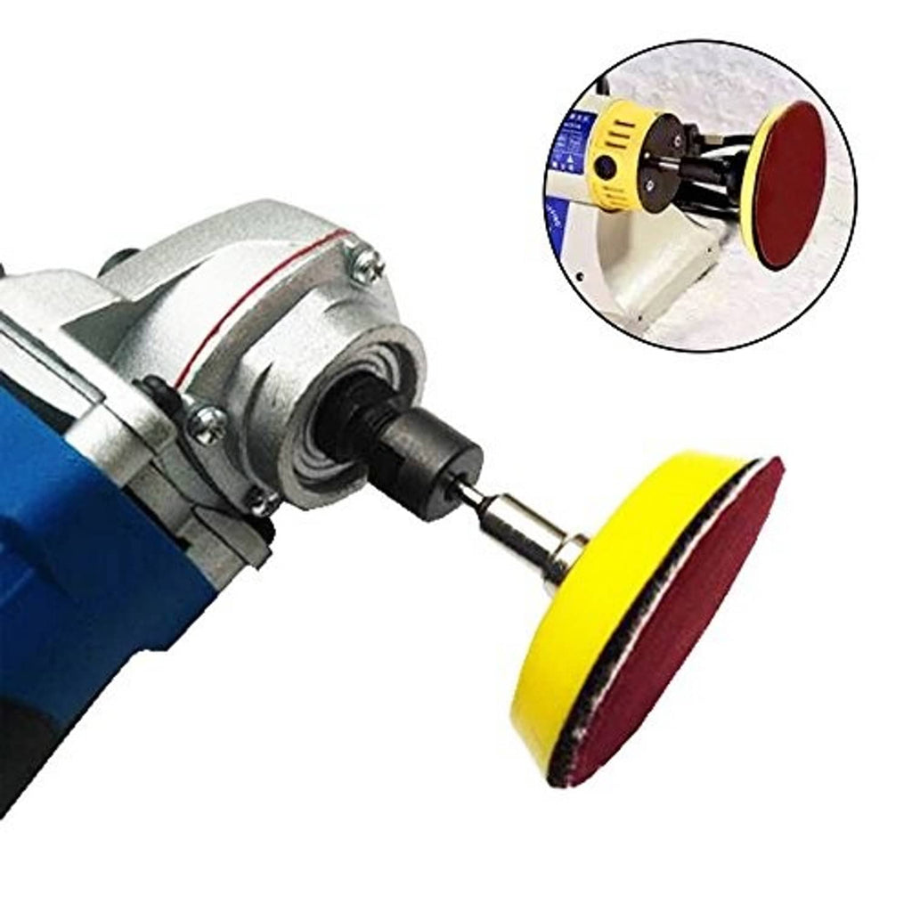 Drill-mounted sanding disc attachment with yellow backing plate and red abrasive pad