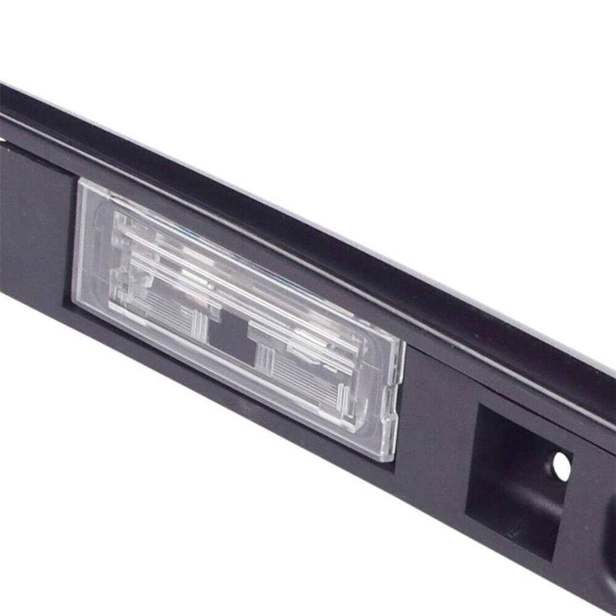 Black tailgate grip handle trim featuring a clear rectangular light lens