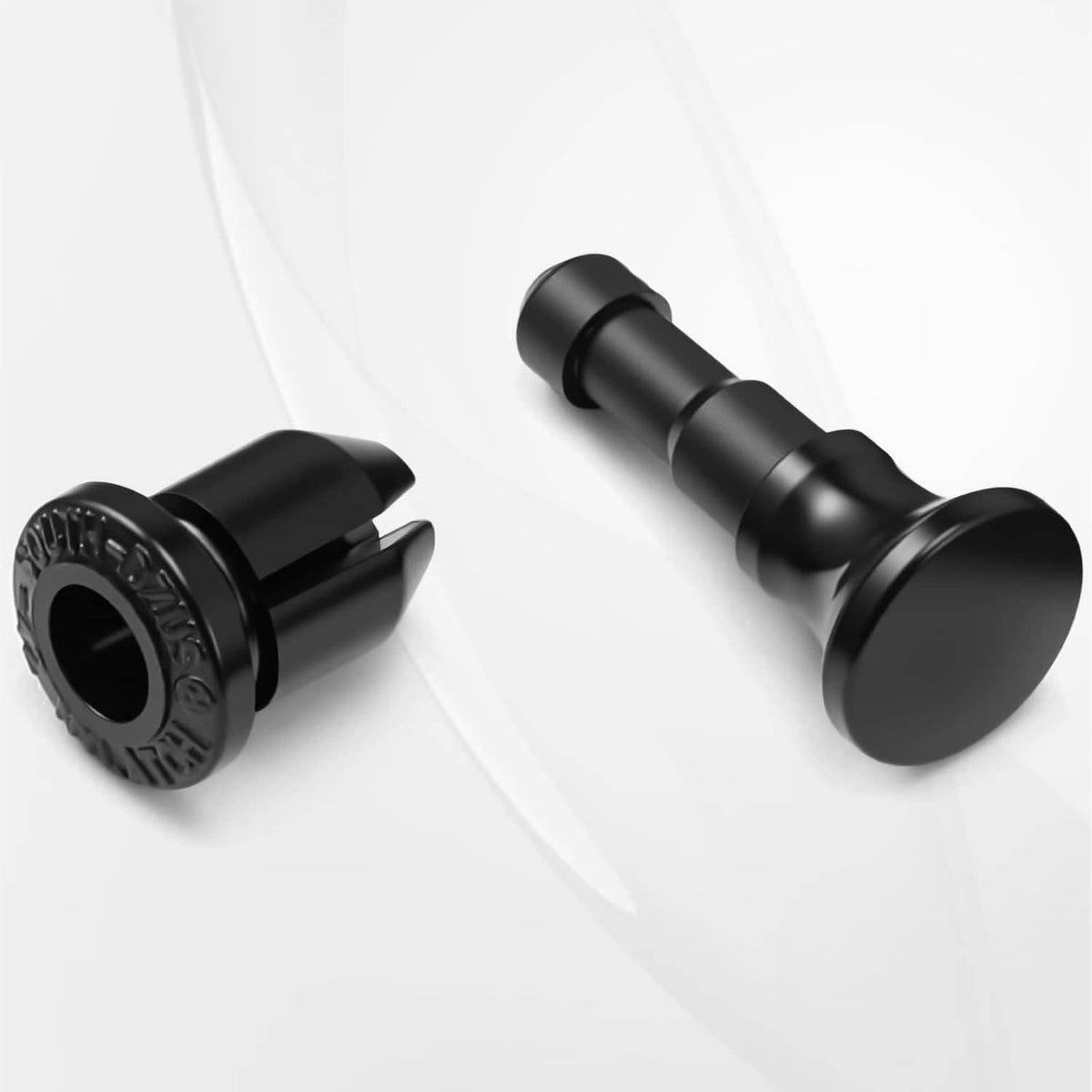 Black push lock pin pair with flange base and ribbed connector opening