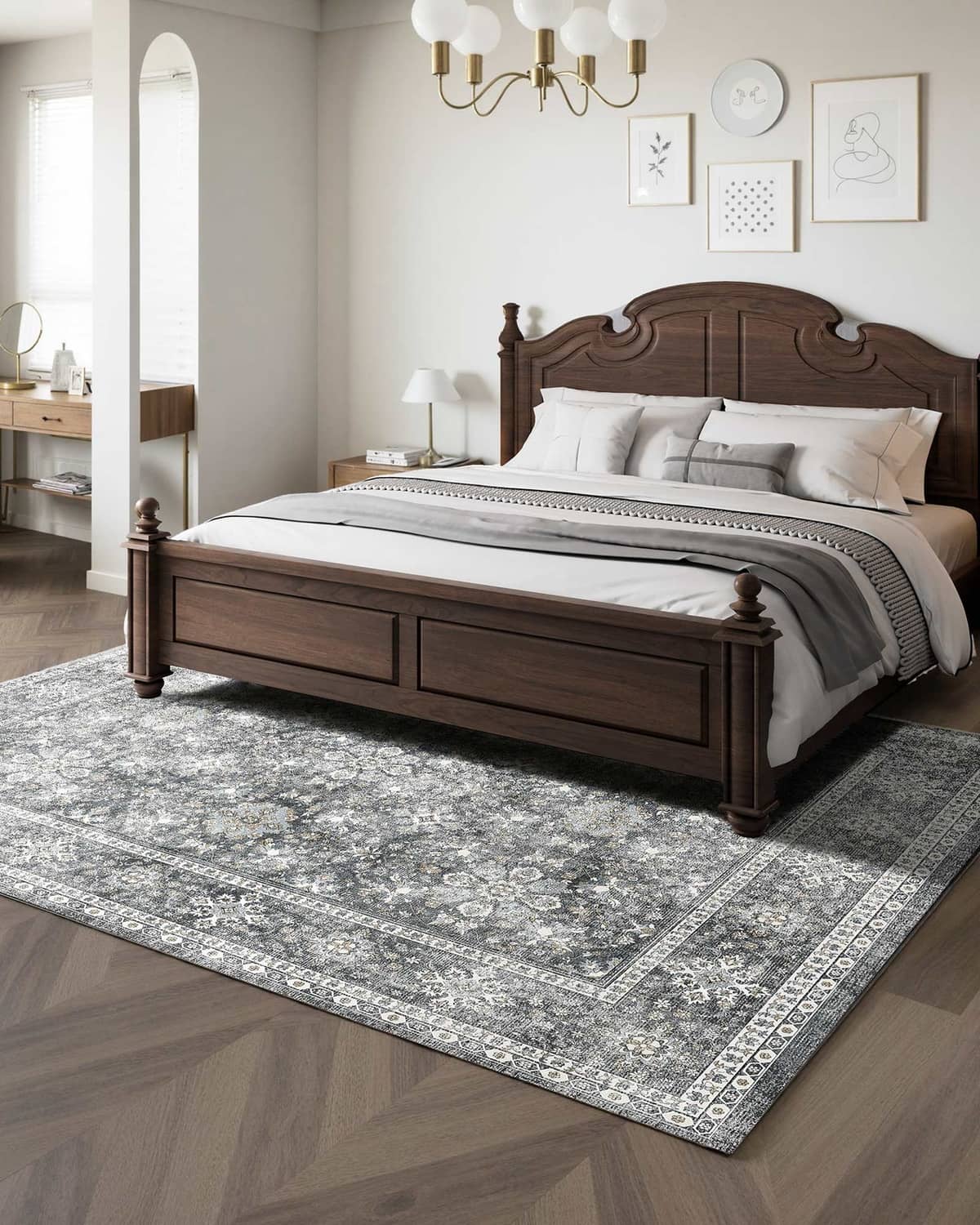 Gray vintage area rug with distressed medallion design and ornate border