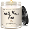 Scented soy candle jar with black lid, 'Hello There Fall' label and leaf icon