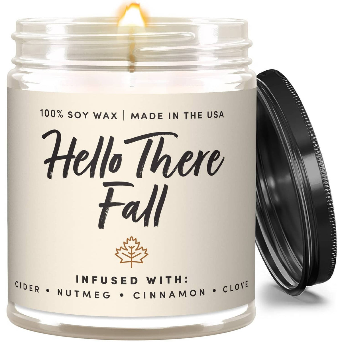 Scented soy candle jar with black lid, 'Hello There Fall' label and leaf icon