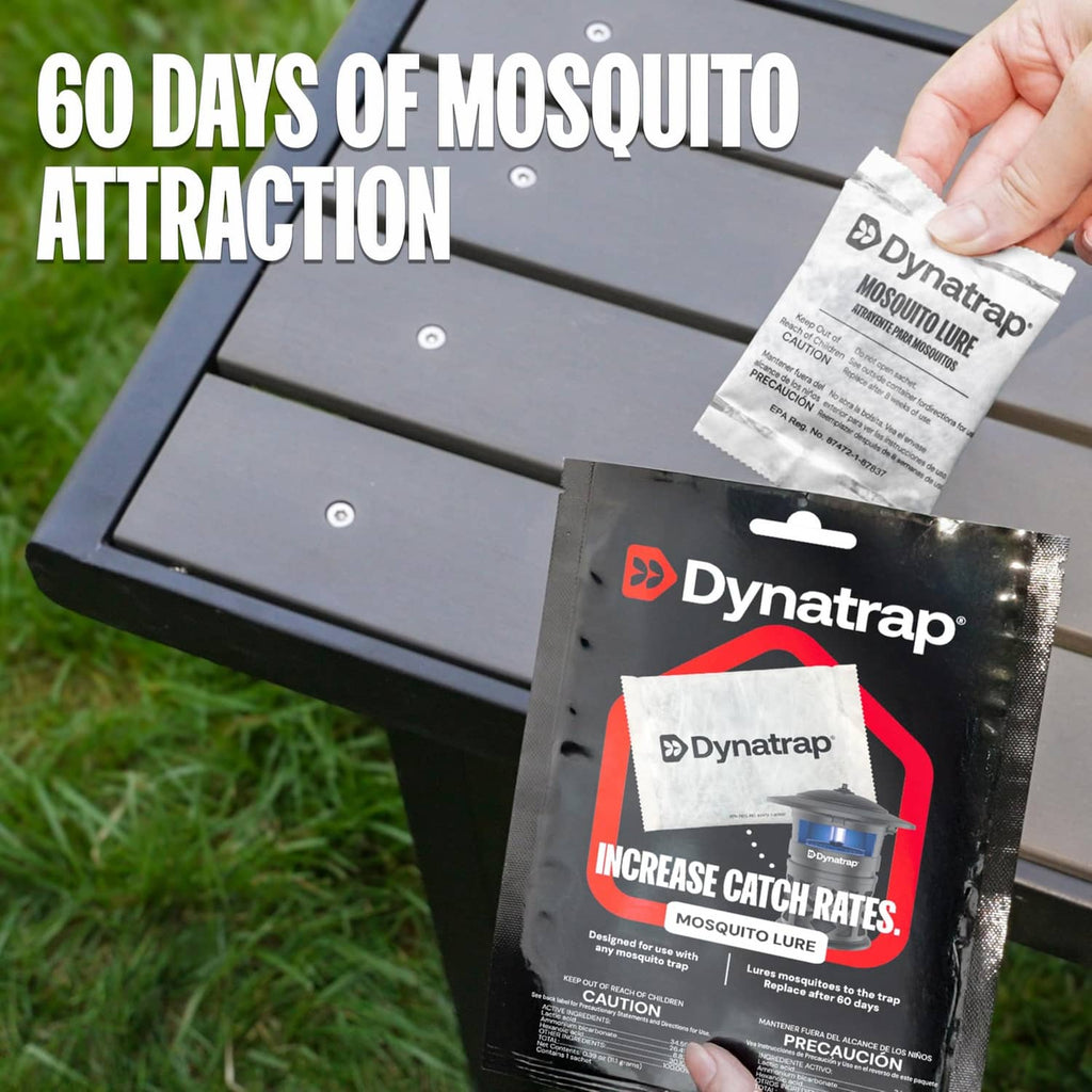 Hand holding white mosquito lure sachet over outdoor insect trap