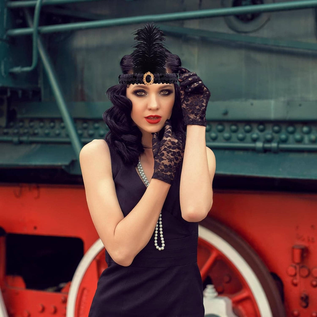 Black feather headband, long pearl necklace, black lace gloves