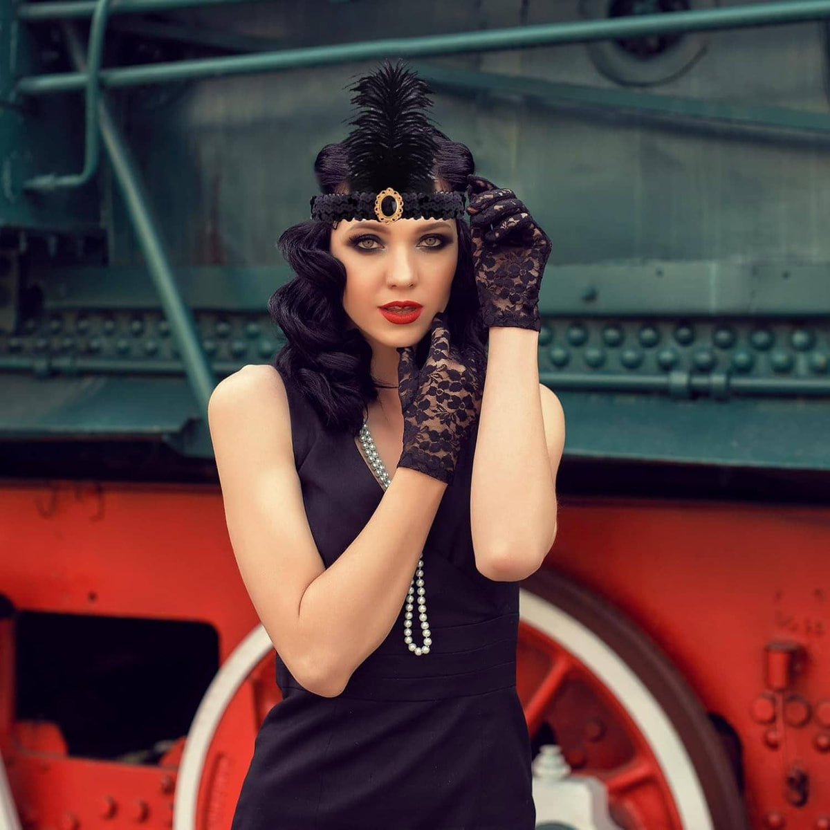 Black feather headband, long pearl necklace, black lace gloves