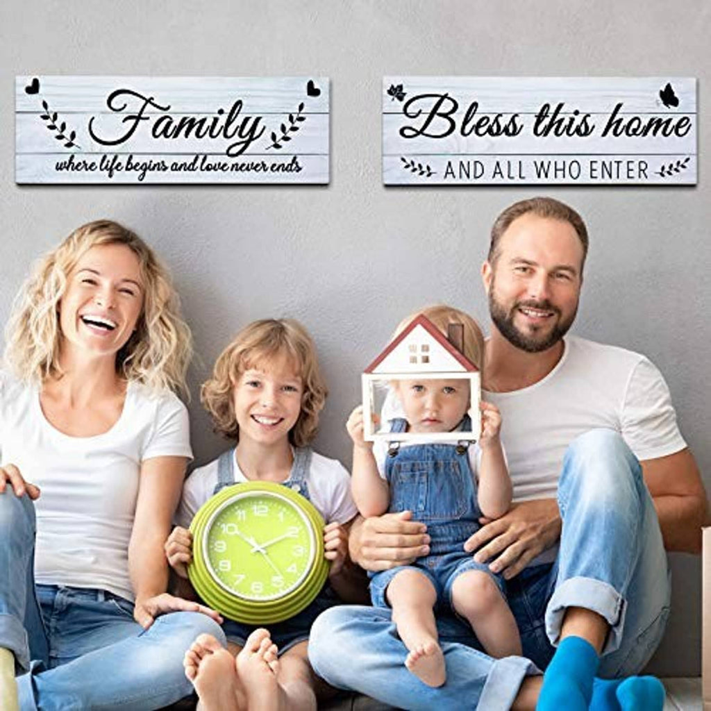 Set of two rustic wooden wall signs featuring “Family” and “Bless this home” text