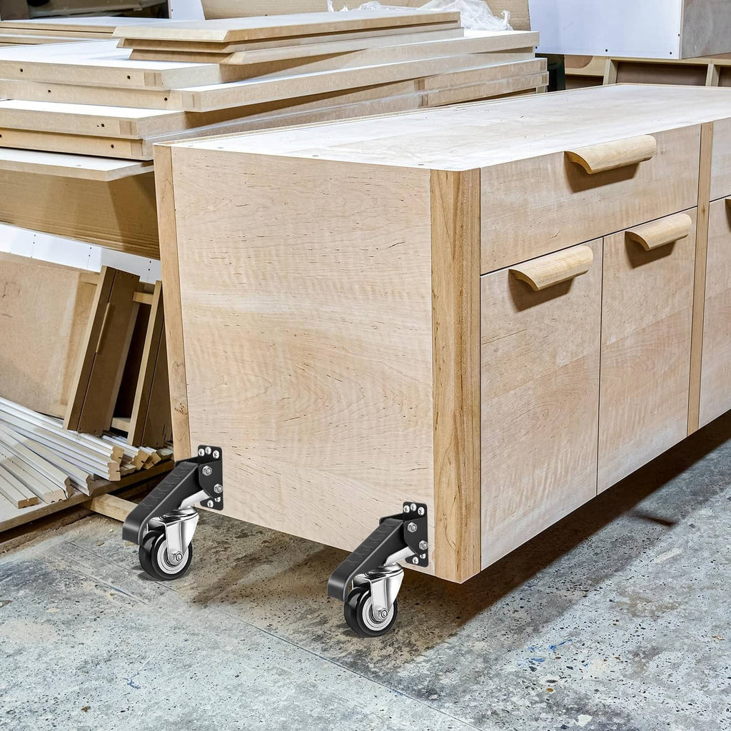 Workbench resting on four swivel casters with black mounts and silver wheels on floor.