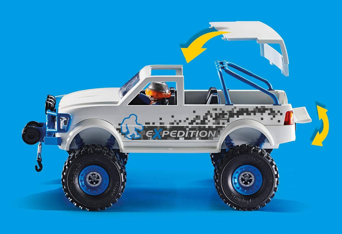 Playmobil off-road snow vehicle side view with blue wheel accents and orange-helmet driver