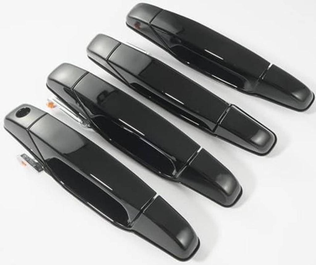 Four glossy black exterior door handles arranged in two rows, top-down view