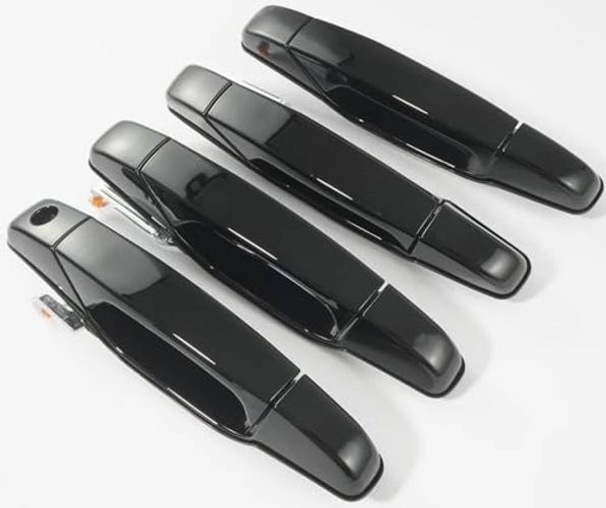 Four glossy black exterior door handles arranged in two rows, top-down view