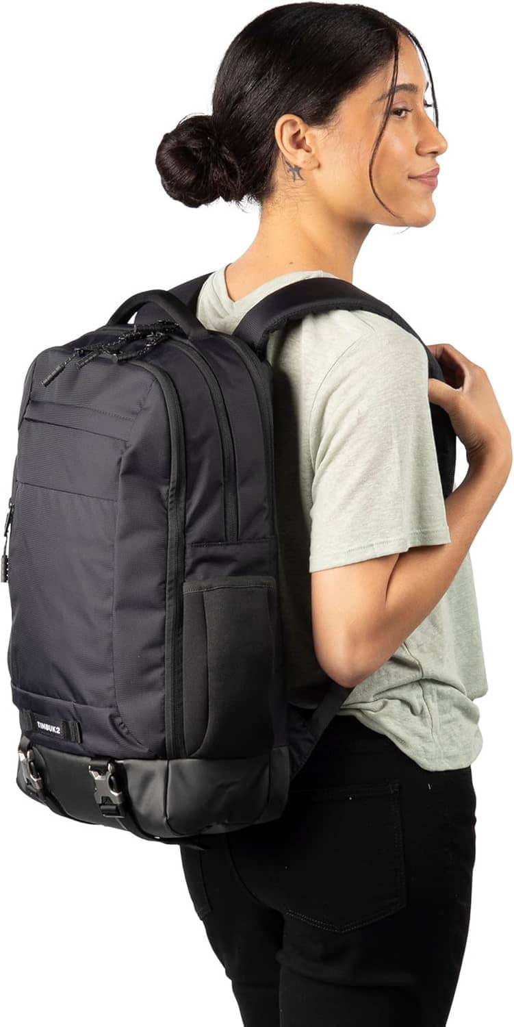 Black Authority laptop backpack worn from side with adjustable shoulder straps