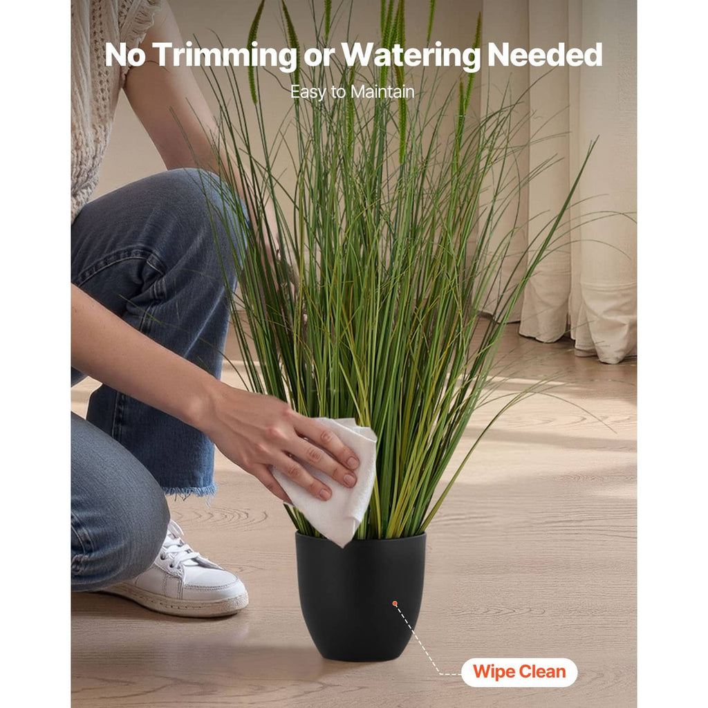 Artificial cattail grass in a black pot, green stems; wipe-clean surface design