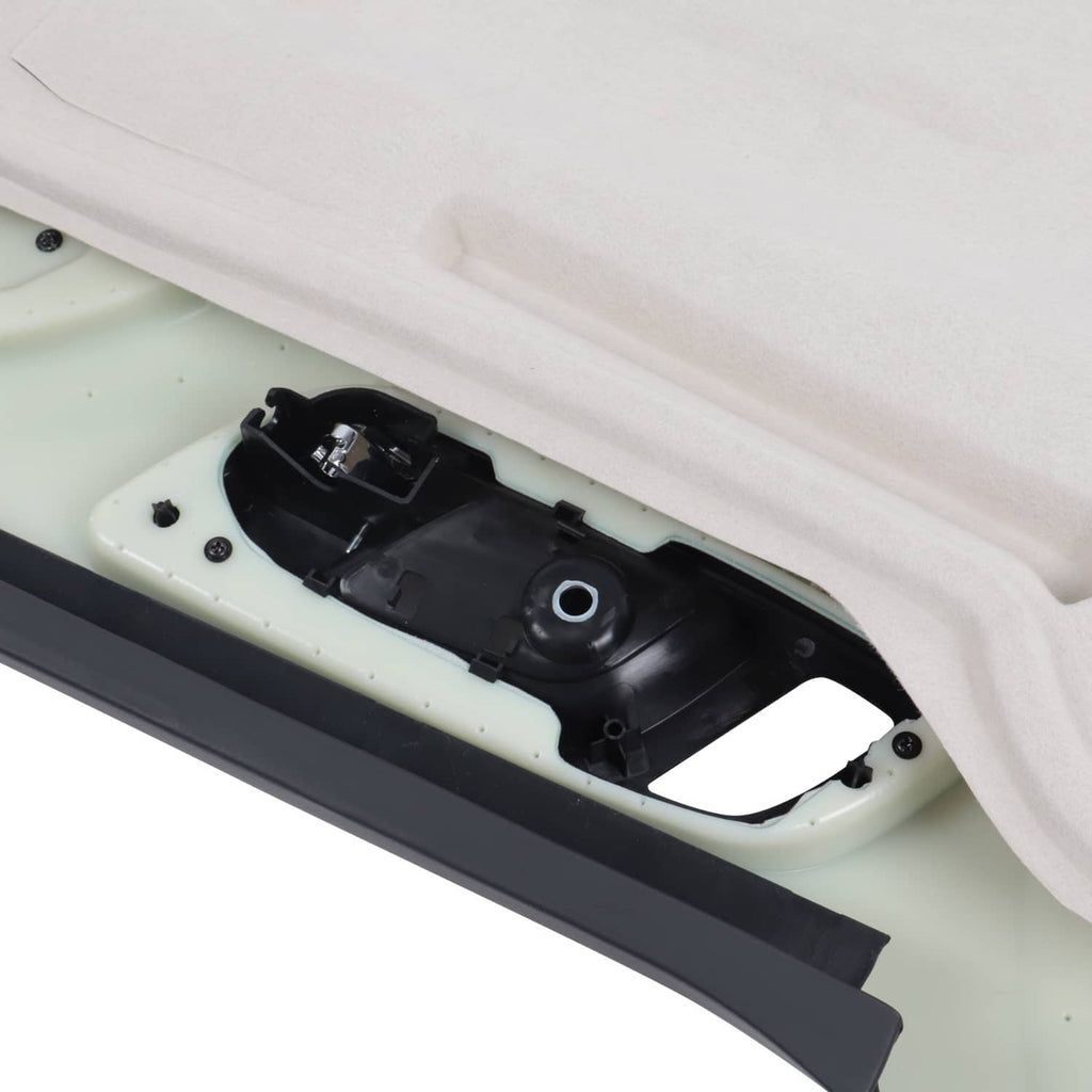 Close-up of inner door trim switch housing and connector area on light backing.