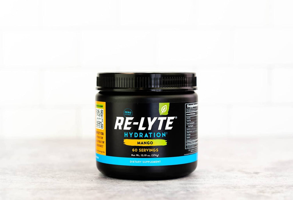 Mango electrolyte hydration powder jar, black lid, front label facing forward