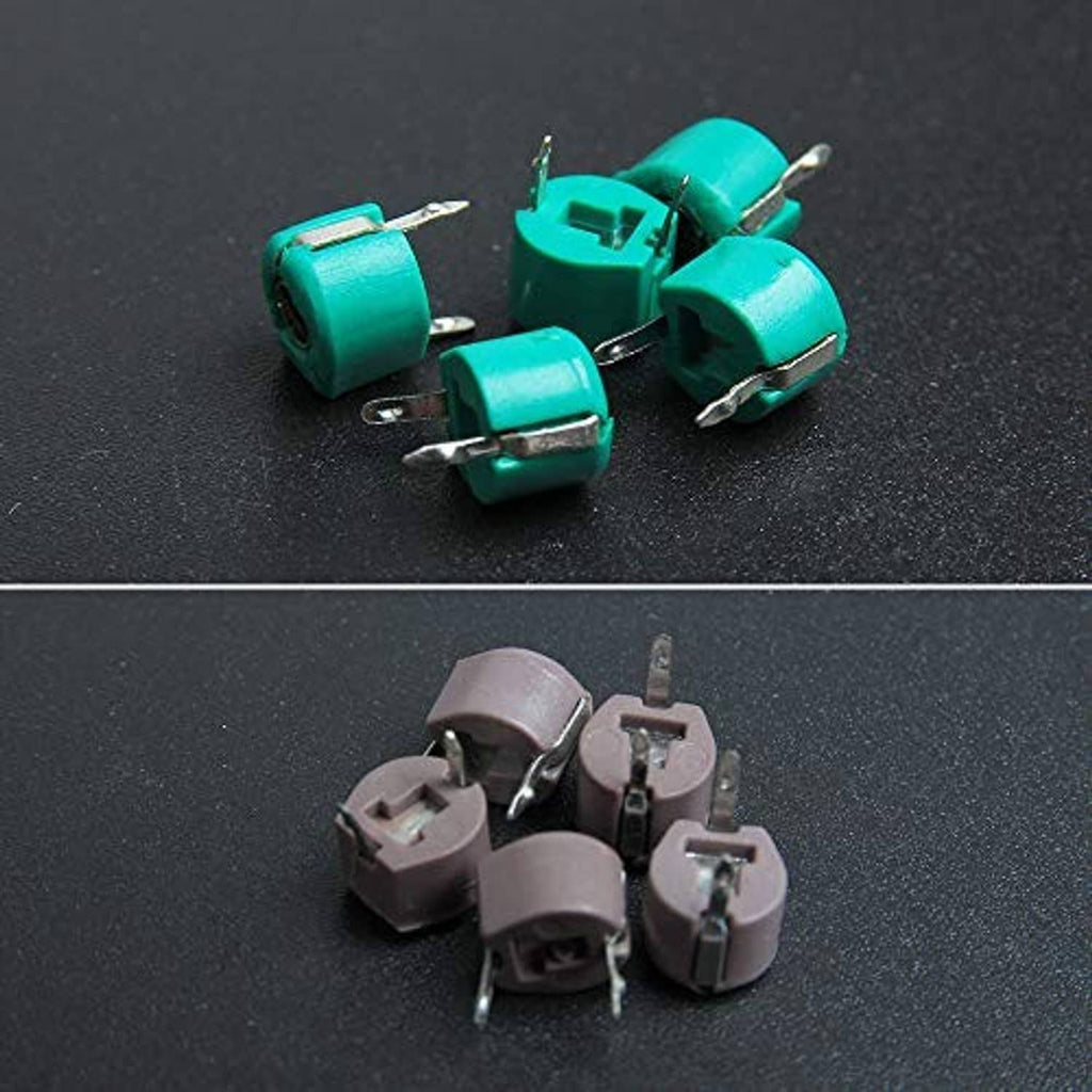 Assorted green trimmer capacitors with metal pins, round ceramic housings