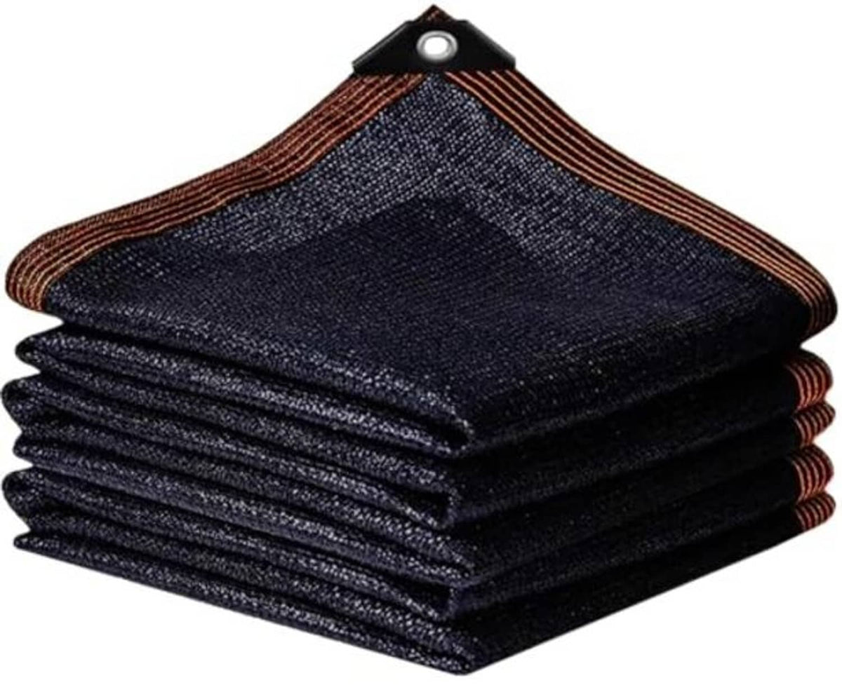 Folded dark shade cloth mesh tarp with brown trim and grommet at the top