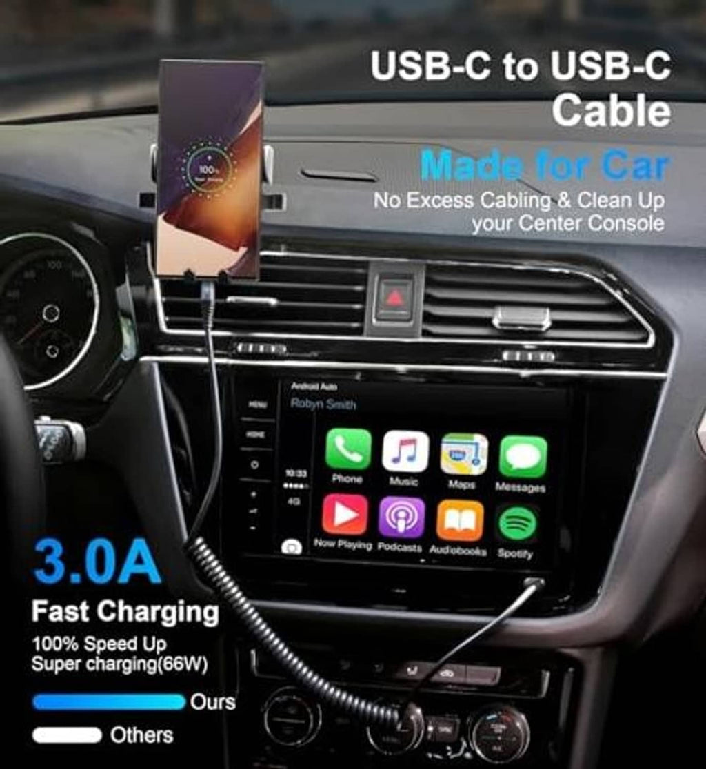 Black USB-C to USB-C coiled car charger cable plugged near center console