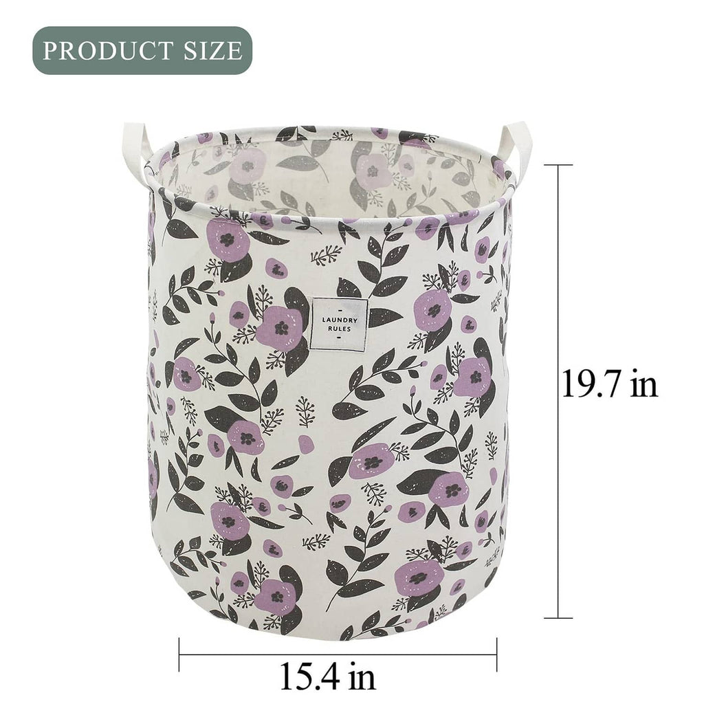 Large collapsible laundry basket, white with purple floral leaf pattern and carry handles.