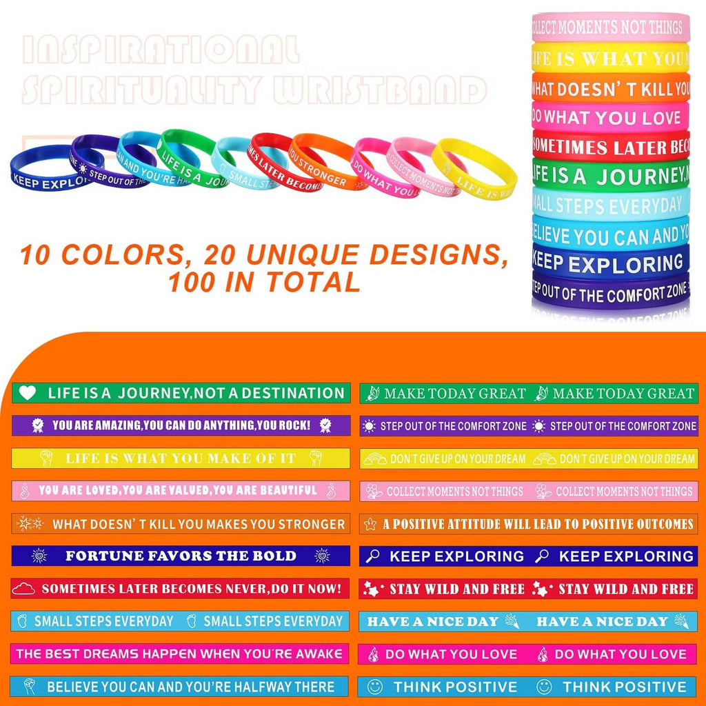 Assorted multicolor motivational silicone wristbands laid out, printed sayings on bands