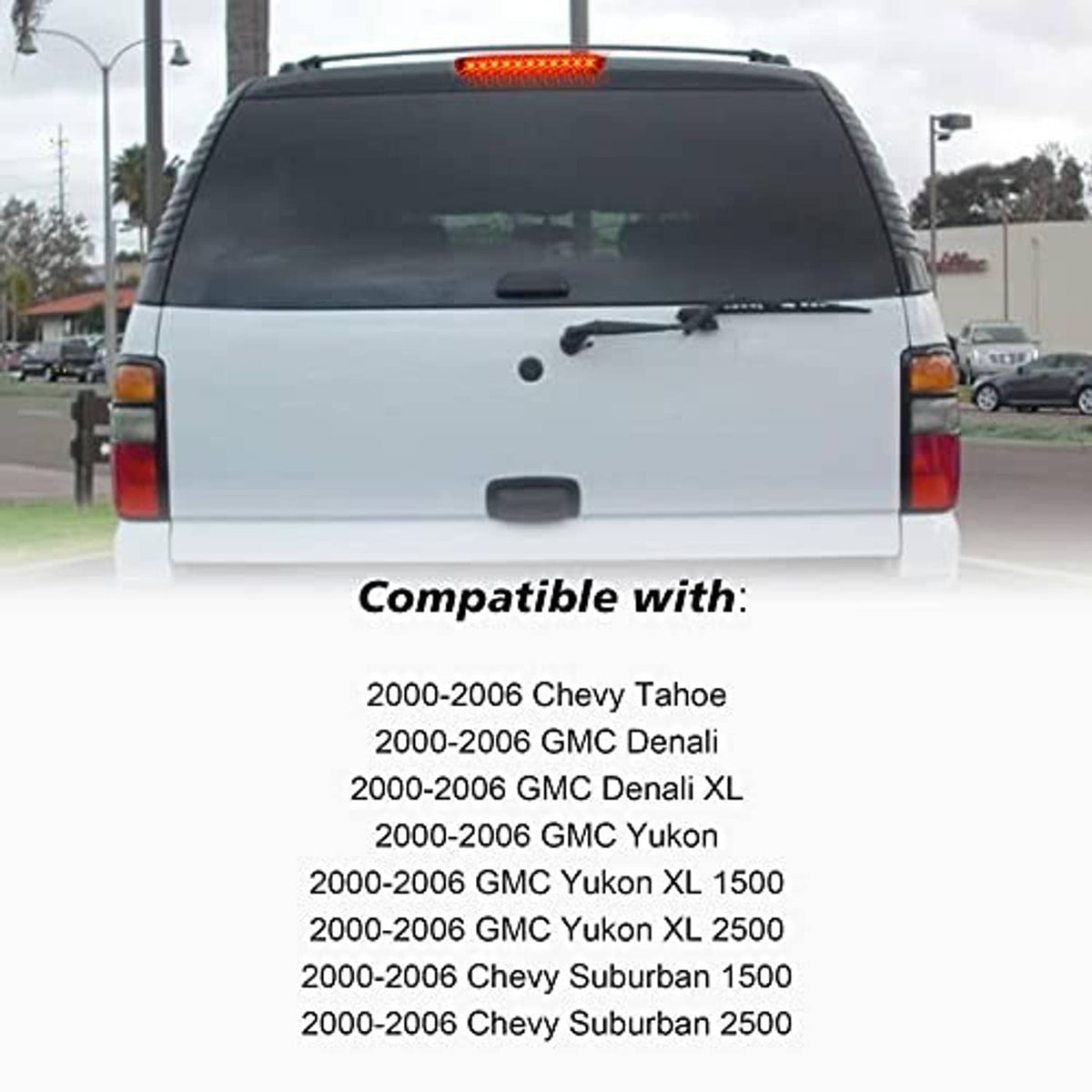 Red LED third brake light bar on rear hatch of a white SUV