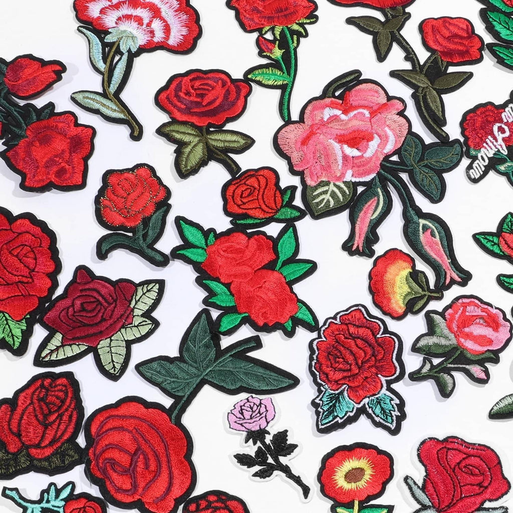 Assorted embroidered flower patches with red and pink blossoms and green foliage