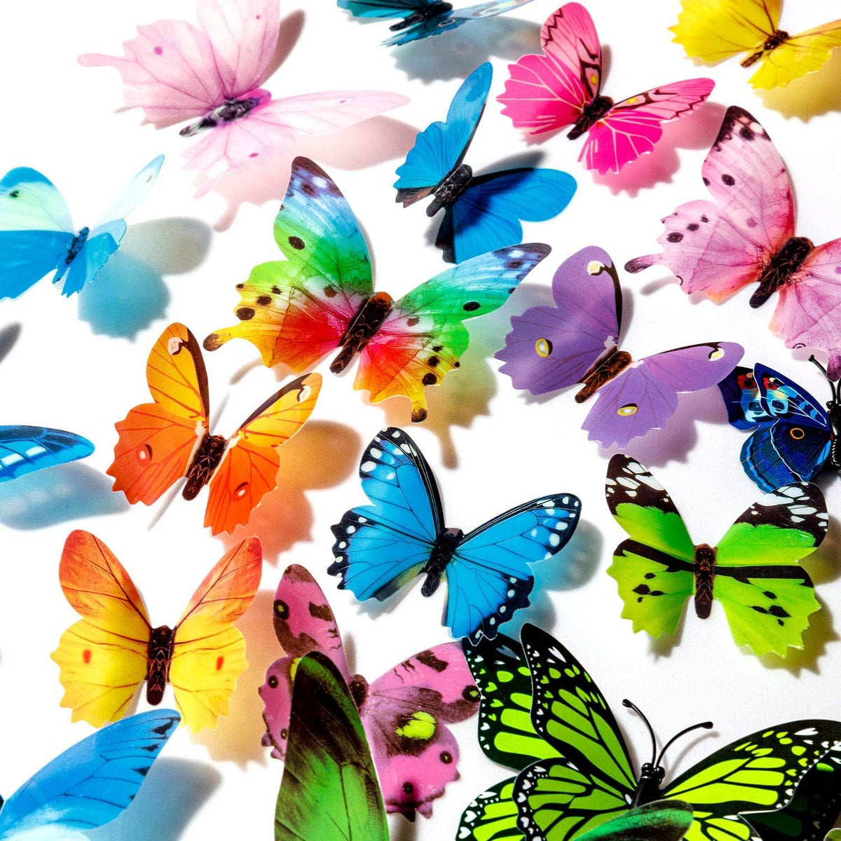 Close-up of colorful butterfly wall decals in blue, pink, orange, and purple tones