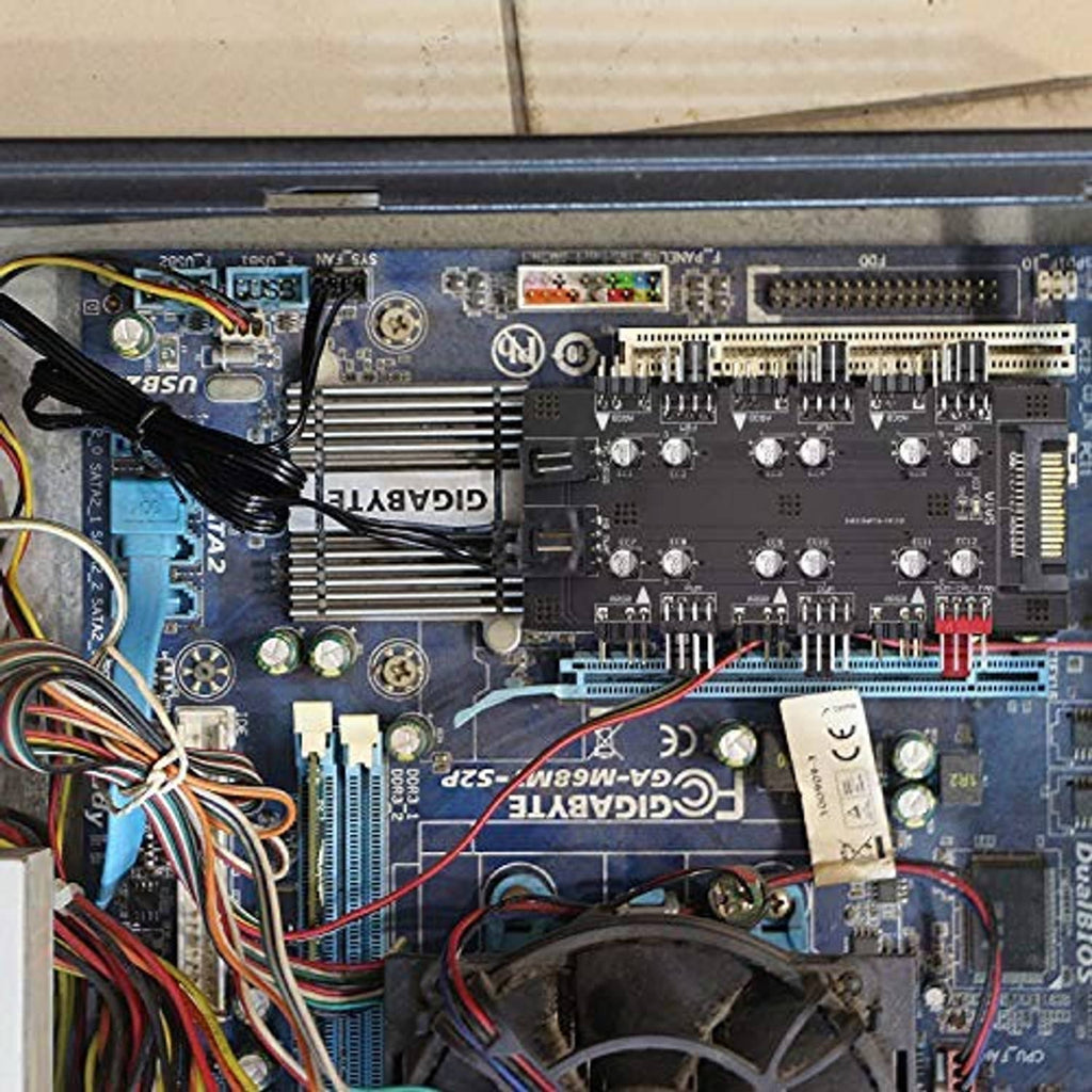 Fan hub controller board installed on motherboard with multiple pin headers connected