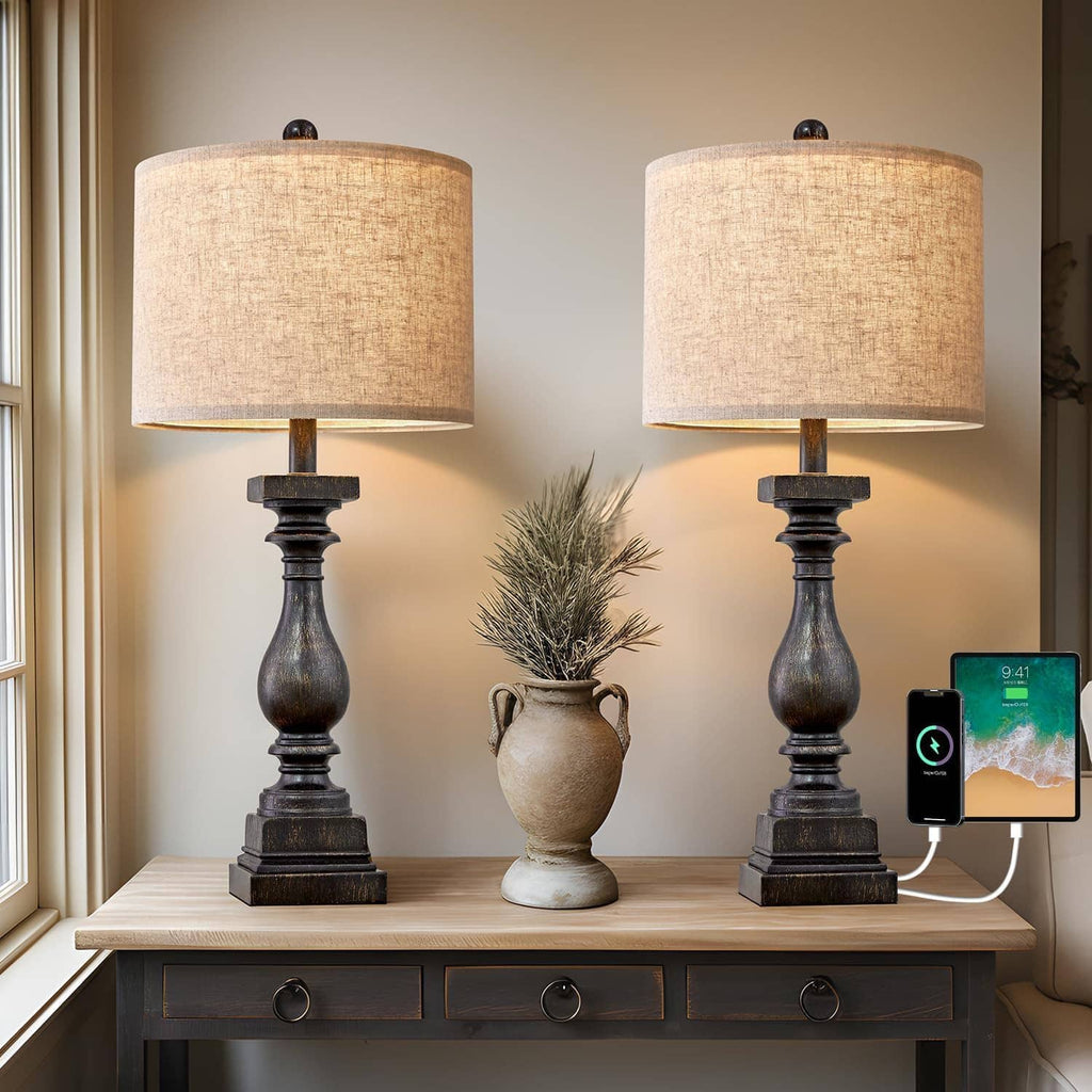 Pair of black table lamps with beige drum fabric shades