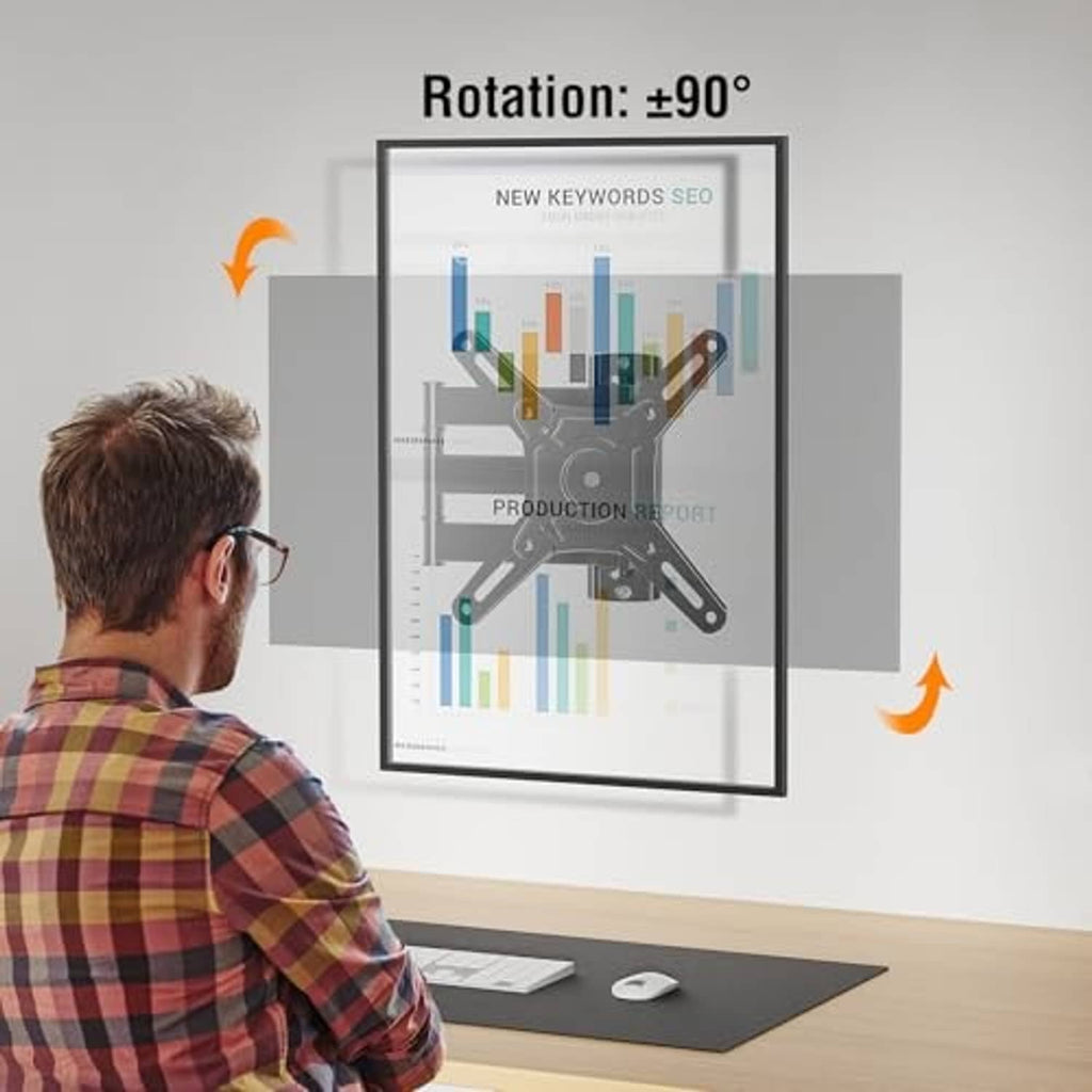Full-motion TV wall mount bracket attached to a monitor stand on a desk setup