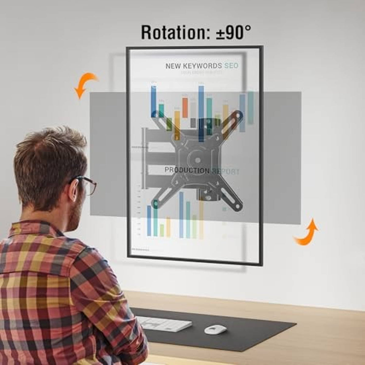 Full-motion TV wall mount bracket attached to a monitor stand on a desk setup