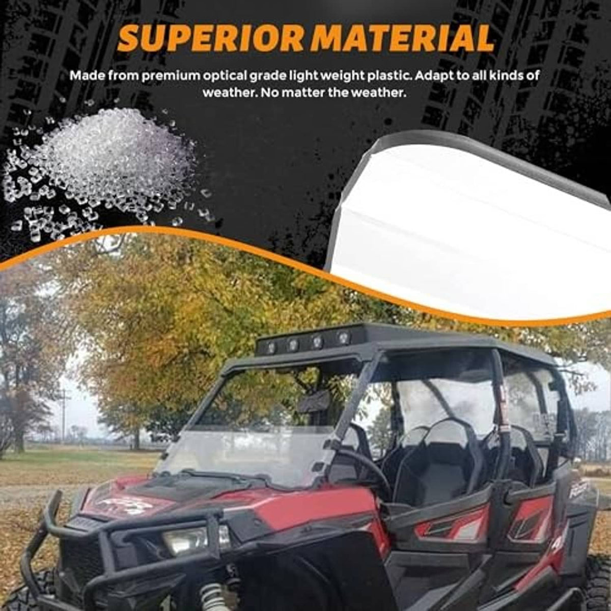 Half windshield with clear panel on red UTV, top light bar visible