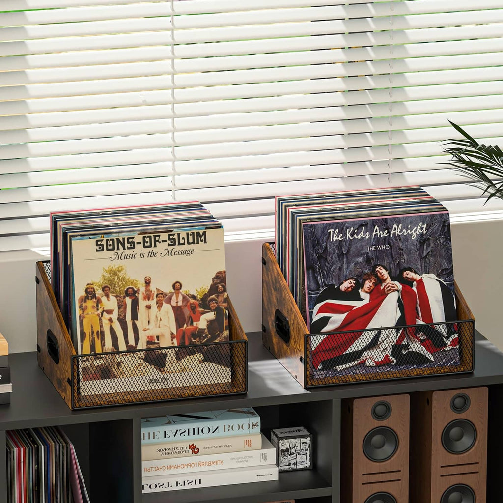 Rustic brown record crate with black wire mesh front holding stacked vinyl records