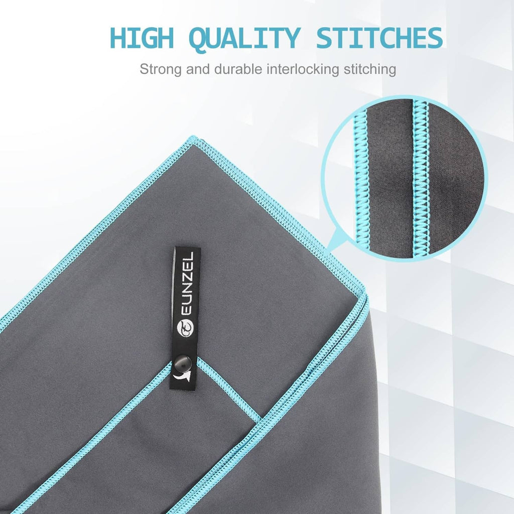 Corner detail of quick-dry towels with reinforced stitching and turquoise binding