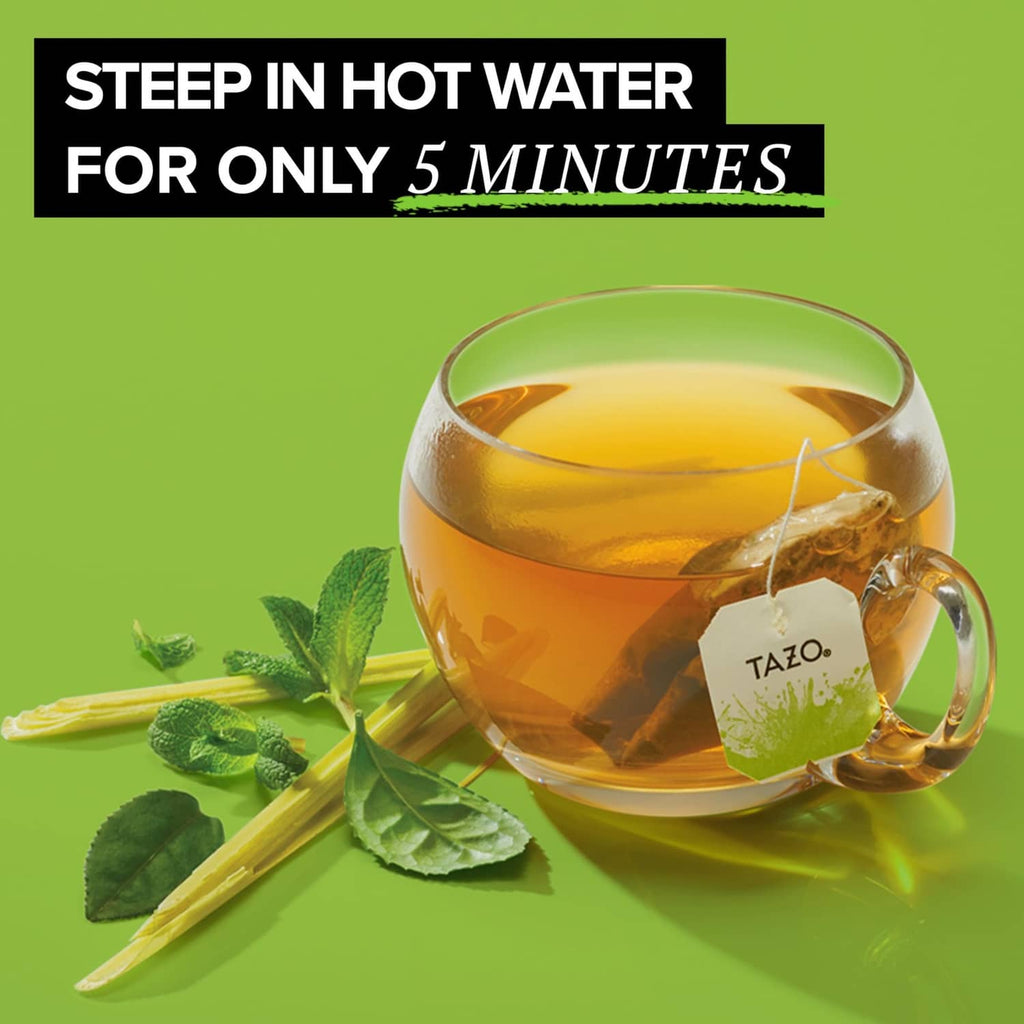 Hot green tea in a glass cup with mint leaves