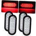 Oval LED trailer tail light with clear lens, red glow, black rubber housing
