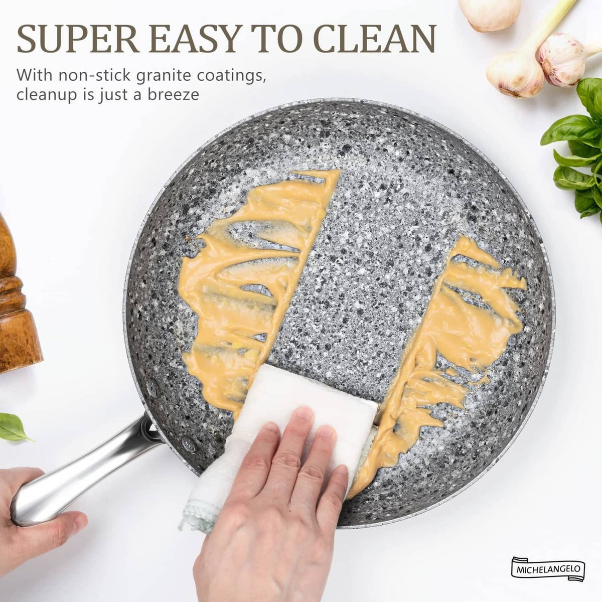 8-in gray granite nonstick skillet, hand wiping the speckled cooking surface.