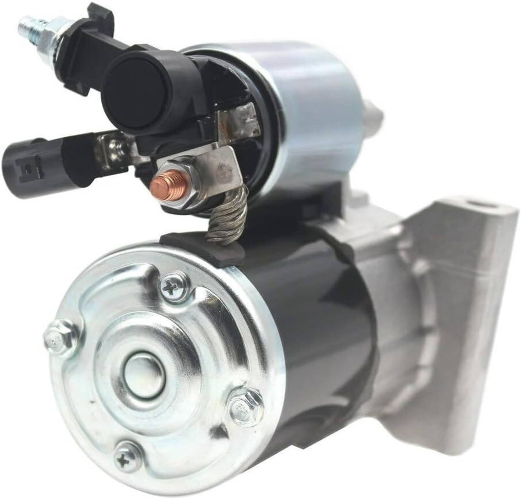 Starter motor with silver end cap and black connector, showing wiring and contacts