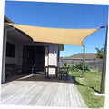 Sand rectangle shade sail canopy stretched between posts for backyard UV shade
