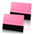 Pink plastic vinyl squeegee tool set with black felt edge pads, shown side by side