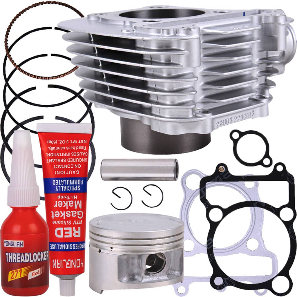 ATV top-end rebuild kit showing cylinder, piston, rings, gaskets, wrist pin, sealant